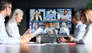 Global business leaders discussing strategy and innovation in a modern corporate office environment.